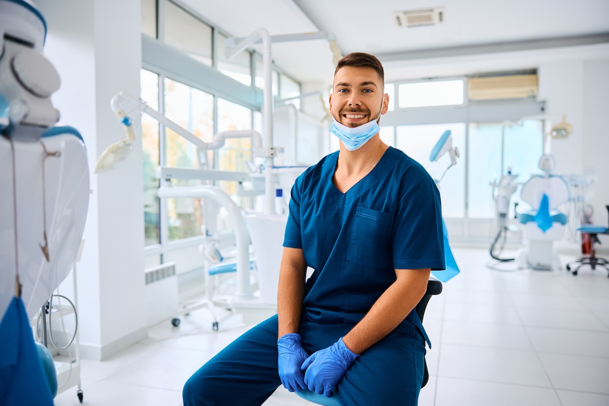 Dentist reviewing own-occupation disability insurance policy for income protection in a dental practice.