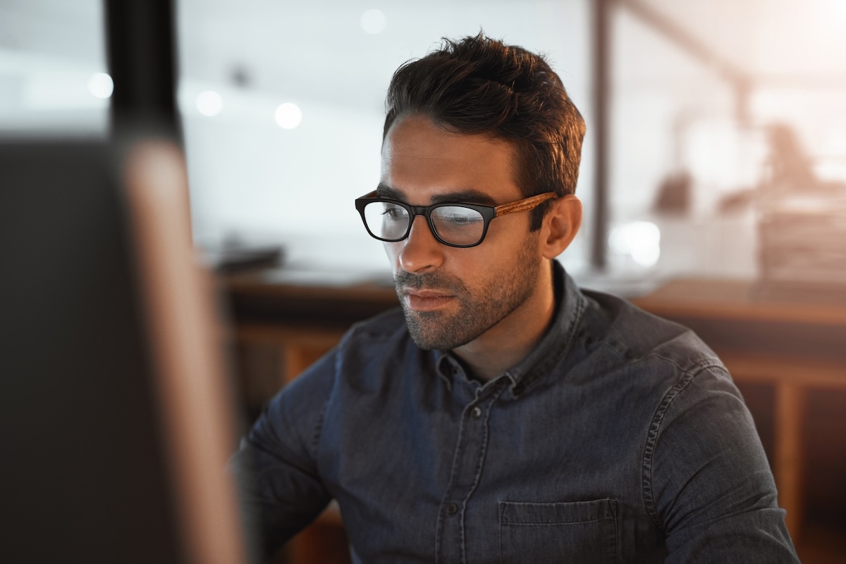 Sole proprietor and 1099 independent contractor working at a computer, the freelancer profile most often buying disability insurance for the self employed from Guardian, Principal Financial Group, MassMutual, Ameritas, or The Standard for monthly income replacement
